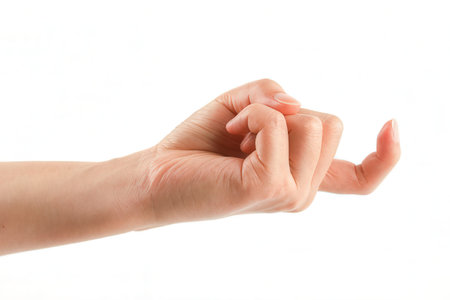 Female hand on a white background. Isolated. Close-up.の素材