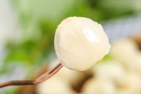Close-up of a spoon with fresh white food.の素材