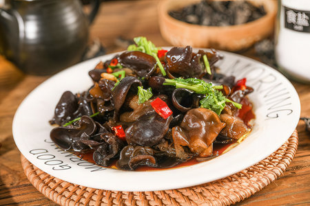 chinese cuisine, stir-fried black oyster mushroom on plateの素材