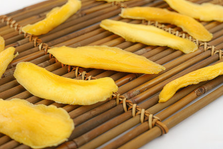 mango slices on bamboo napkin, close-up, macroの素材