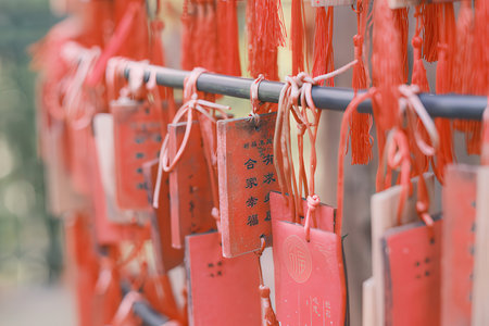 Red paper lanterns in chinese temple, closeup of photoの素材