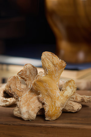 Ginger root on a wooden table, shallow depth of field.の素材