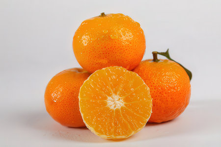 Tangerines on a white background. Shallow depth of field.の素材