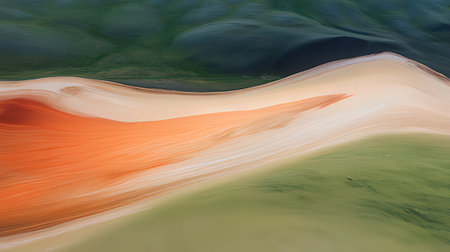 Abstract background of water surface with orange and green waves. Natural background.の素材