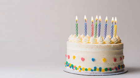 Birthday cake with candles on a white background with copy space.の素材
