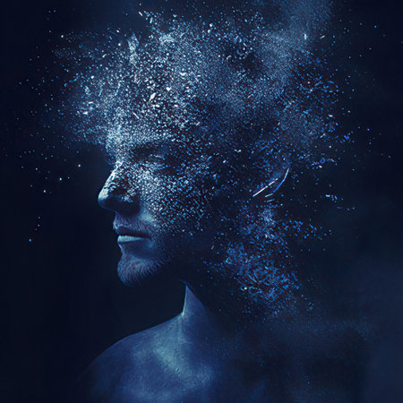 Artistic portrait of a man painted in blue paint on a black backgroundの素材