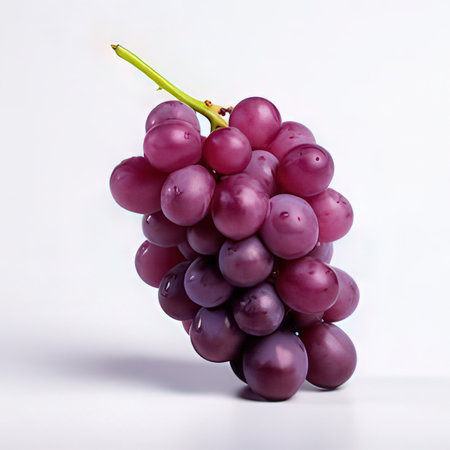 Bunch of ripe purple grapes on a white background. Close-up.の素材