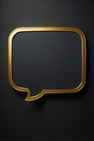 Gold speech bubble on a black background.の素材