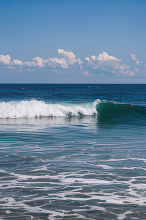 Beautiful seascape with waves and clouds on blue sky.の素材
