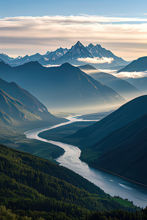 Mountain landscape with lake and snow-capped peaks at sunset.の素材