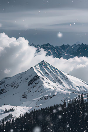 Snowy mountain peak in the clouds. Winter landscape with snow covered peaks.の素材