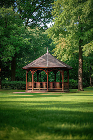 Wooden gazebo in the park. Summer landscape.の素材