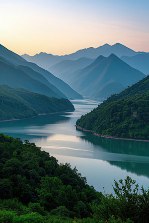 Beautiful landscape of lake and mountains at sunset in the evening.の素材