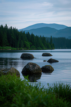Beautiful lake in the mountains in the evening. Summer landscape.の素材