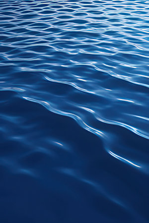 blue water surface with ripples close up. abstract background and textureの素材