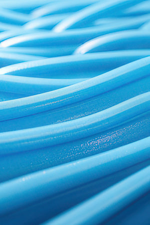 Close-up of blue plastic hose. Texture and background for design.の素材