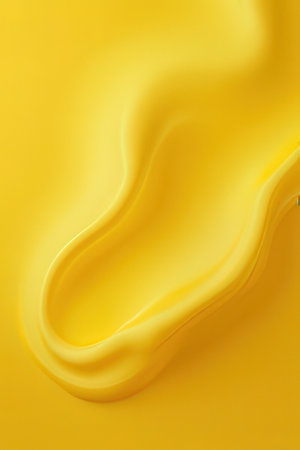 abstract background of yellow liquid or paint with some smooth lines in itの素材