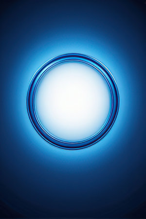 Blue light circle on blue background. 3d render. Abstract background.の素材