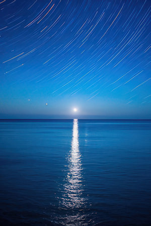 Beautiful starry sky over the sea. Long exposure photo.の素材