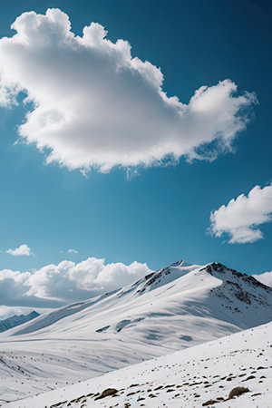 Mountain landscape with snow and blue sky. Caucasus Mountains, Georgia, region Gudauri.の素材