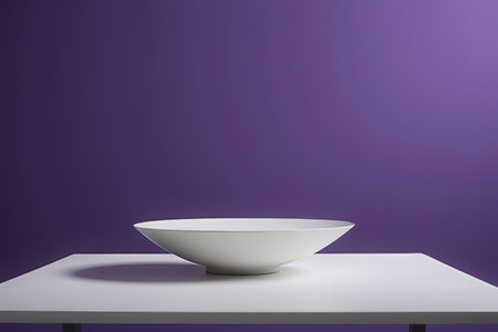 White bowl on white table against purple background, stock photoの素材