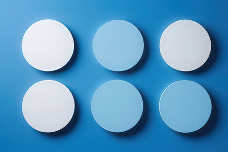 Blank paper circles on blue background, 3d rendering. Computer digital drawing.の素材