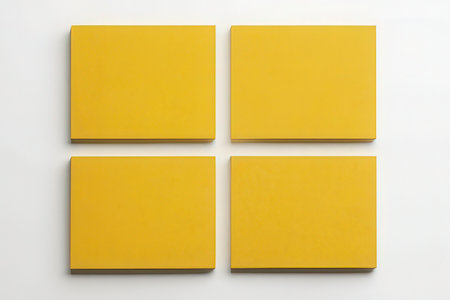 Blank yellow business cards on white background. Mockup for identity.の素材