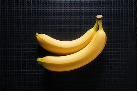 Bunch of bananas on a black background. Healthy food concept.の素材
