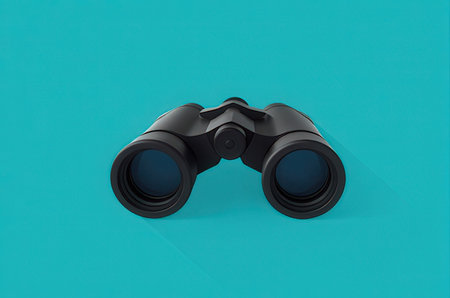 Black binoculars isolated on a blue background. 3d renderの素材