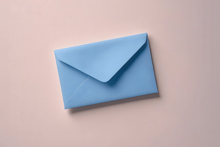 Blue Envelope on a pink background, top view, copy spaceの素材