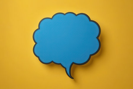 Blue speech bubble isolated on yellow background. Top view. Flat lay.の素材
