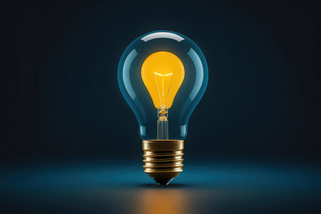 Glowing yellow light bulb on dark background, 3D rendering.の素材