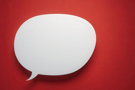 Blank white speech bubble on red background. 3D Renderingの素材