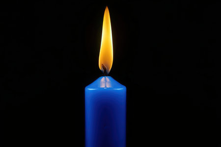 candle on a black background, close-up of a candleの素材