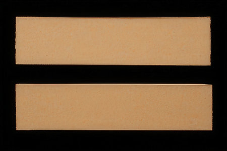 A close up of a cork board on a black background.の素材