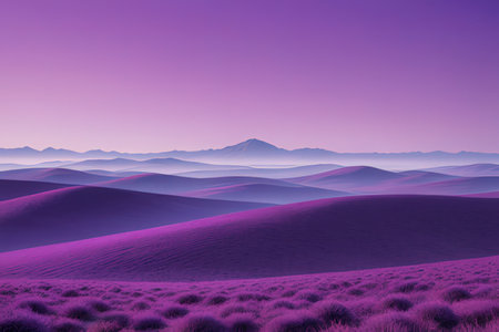 Desert landscape with purple sand dunes and mountains in the backgroundの写真素材