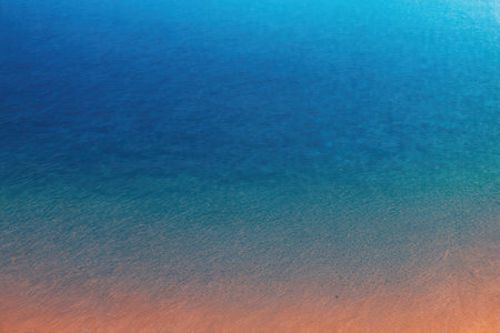 abstract background of water in the sea with orange and blue colors