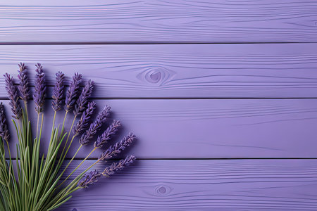 Lavender flowers on purple wooden background. Top view with copy spaceの写真素材