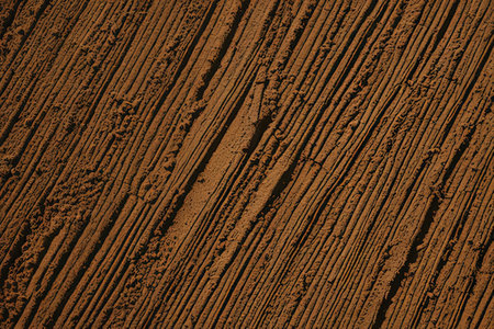 Wooden texture with scratches and cracks in brown tone. Abstract background and texture for design.