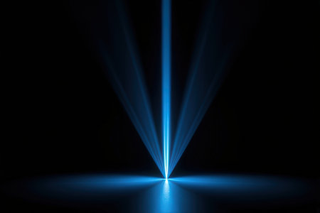 Blue spotlights on a black background. Laser rays in the dark.の素材