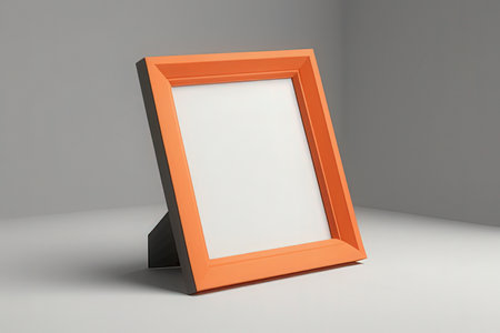 3d rendering of an orange picture frame leaning on a gray wallの素材