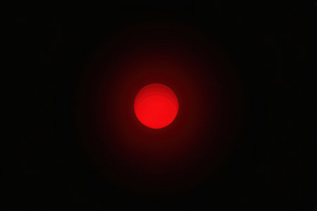 Red light on the black background. Red light on the black background.の素材