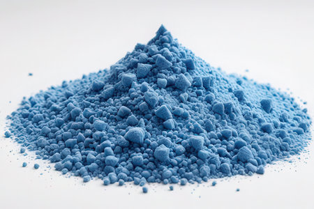 Blue pigment powder isolated on white background. Selective focus with shallow depth of field.の素材
