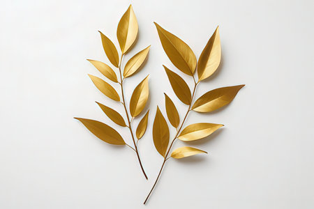 Golden leaves on a white background. Flat lay, top view.