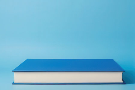 Book on blue background. Education concept. Back to school. Copy space.の写真素材