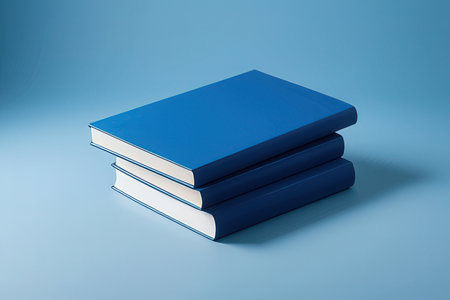 Stack of blue books on blue background. 3d render illustration.の写真素材