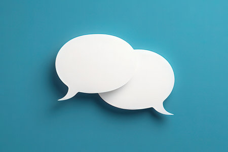 Blank paper speech bubbles isolated on blue background. 3d illustrationの写真素材