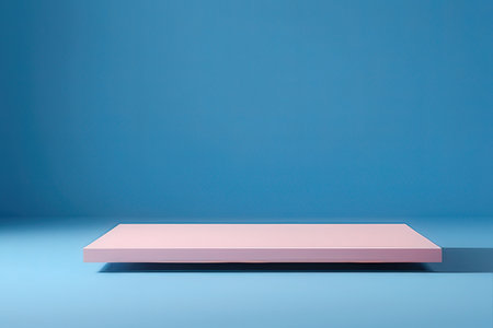 Empty pink podium on blue background with copy space. 3d renderingの写真素材