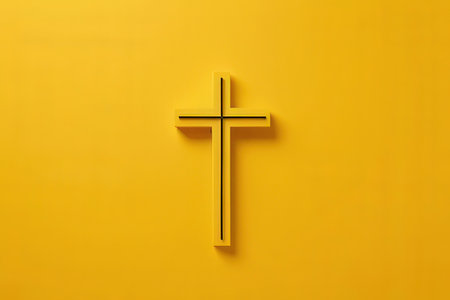 Cross on a yellow background. The concept of religion and faith.の写真素材