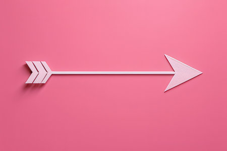 Creative business concept photo of arrow made of paper on pink background.の写真素材